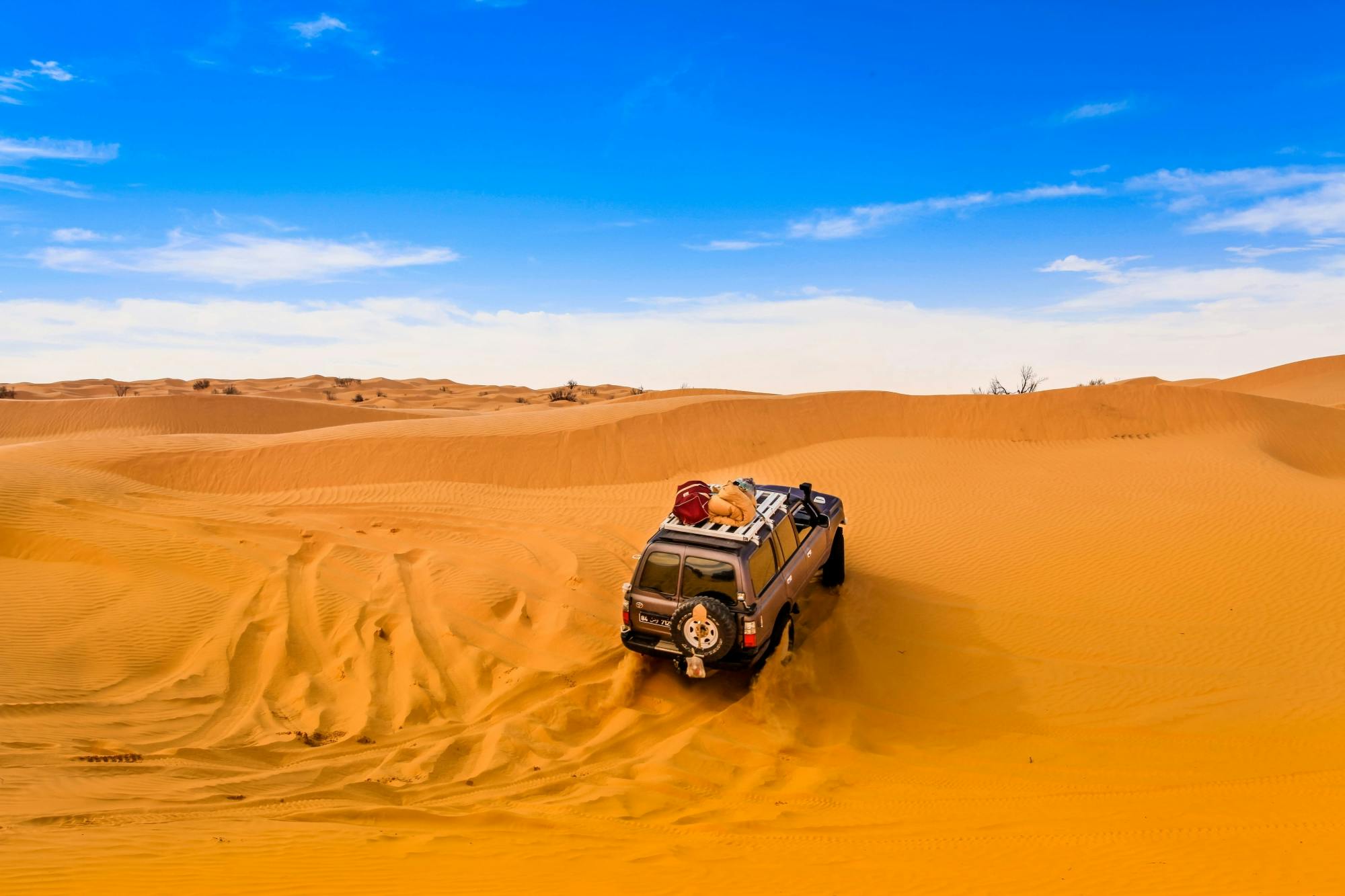 Off-road Vehicle in the Sahara Desert